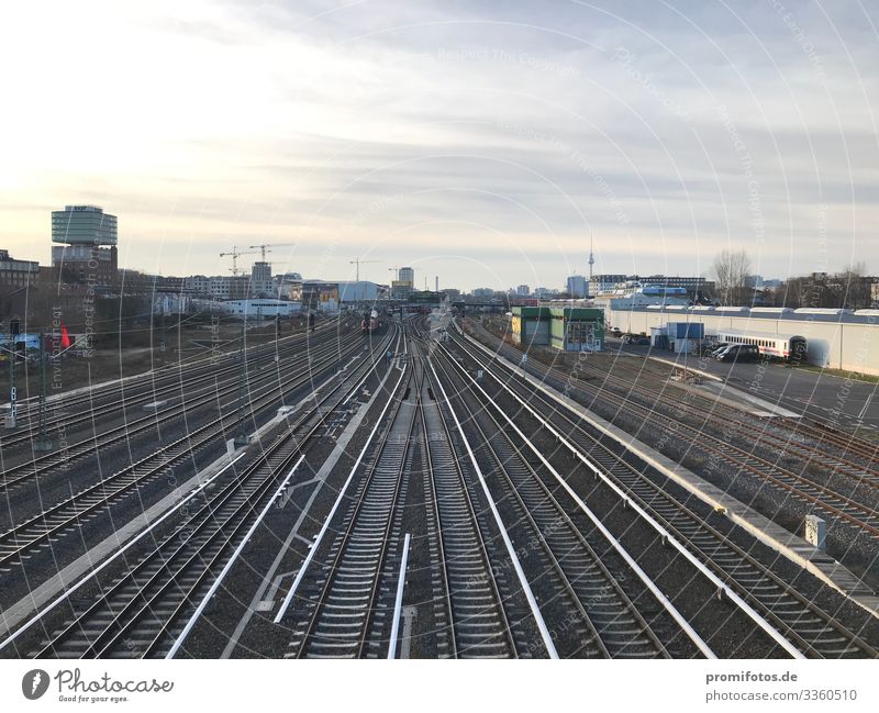 Alle Schienen führen nach Berlin. Town Capital city Train travel Railroad Positive Blue Gray Responsibility train Train station Railroad tracks Climate change