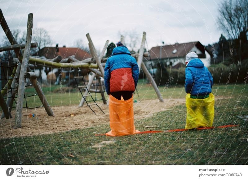 Two Boys Sack Race analog photography Analog analogue photography 35mm film photography Film Scan Leica R7 colorful red yellow outdoor child kids children