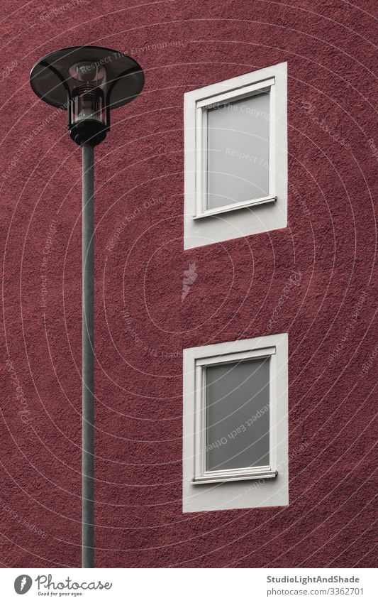 Streetlamp in front of a dark red building Lifestyle House (Residential Structure) Lamp Town Building Architecture Facade Dark Simple Modern New Clean Red White