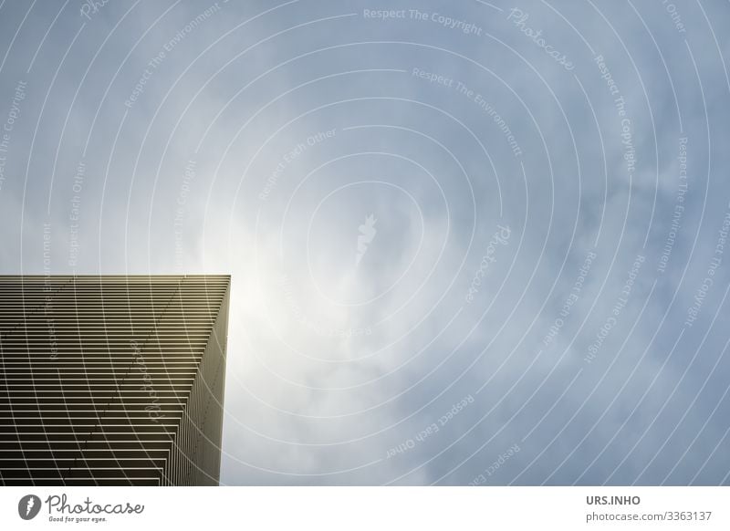 Corner of a building near cloud haze Sky Facade Illuminate Sharp-edged Town Blue Black White Modern Urban building Structures and shapes Stripe Midday sun