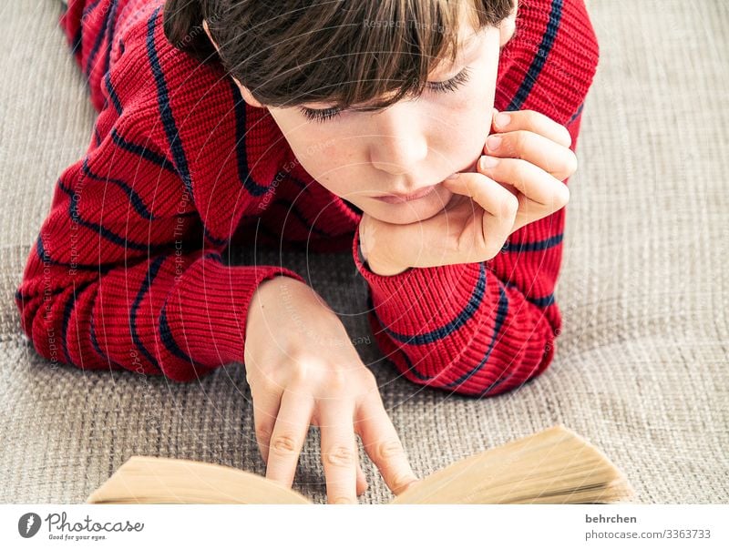 favourite pastime | read 8 - 13 years Fingers Hand Head Family & Relations Hair and hairstyles Face Portrait photograph Interest Interior shot Curiosity