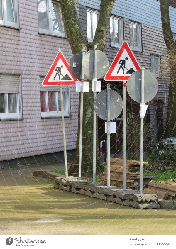 signpost forest Town House (Residential Structure) Facade Window Street Road sign Sign Signs and labeling Signage Warning sign Communicate Stand Many Gray Red