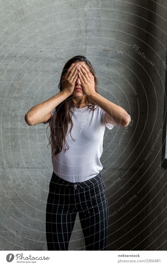 Woman with Hands Covering Eyes Indoor covering eyes hands on face female girl woman young adult day female beauty beautiful woman natural beauty