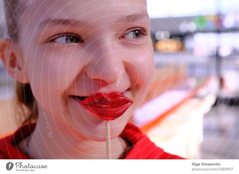 Girl with lollipops in the form of a kiss Heart Beautiful Love Kissing Youth (Young adults) Young woman Red Candy Lollipop Woman Beauty Photography Sweet Happy