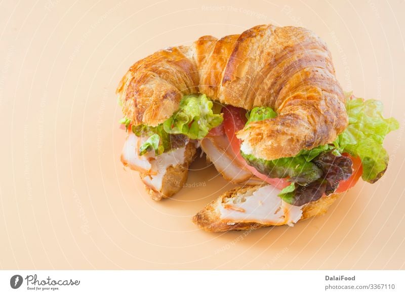 Sandwich of croissant of lettuce, tomato and smoked turkey Bread Croissant Tradition food Ham panini panino pavo Pork Smoked toast toasted Tomato Close-up