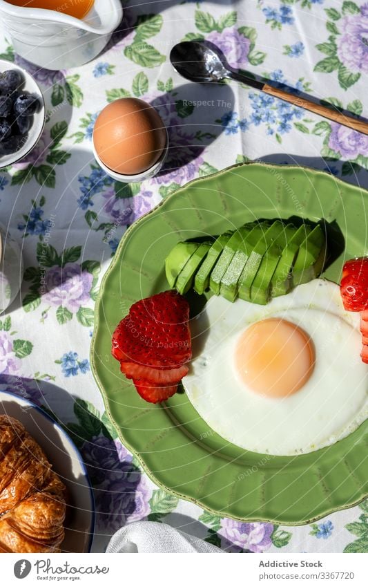 Homemade full brunch healthy breakfast in sunlight avocado table toasts drink organic cooked background tea sunny cup orange juice food ingredient tasty fresh