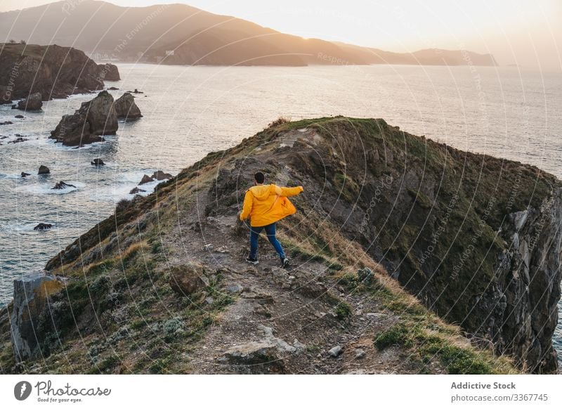 Tourist walking on hill and contemplating wonderful landscape man tourism sea ocean shore coast mountain vacation journey spain travel wanderlust seascape