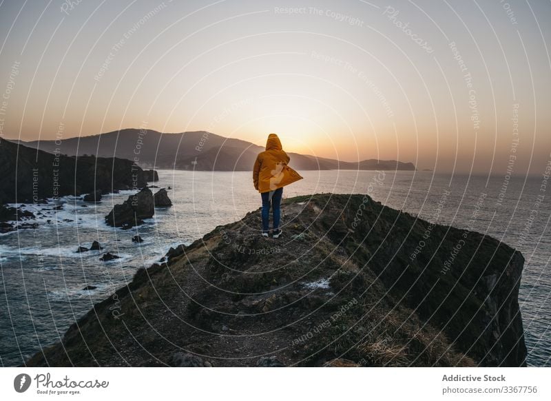 Tourist standing on hill and contemplating wonderful landscape man tourism sea ocean shore coast mountain vacation journey spain water trip travel wanderlust