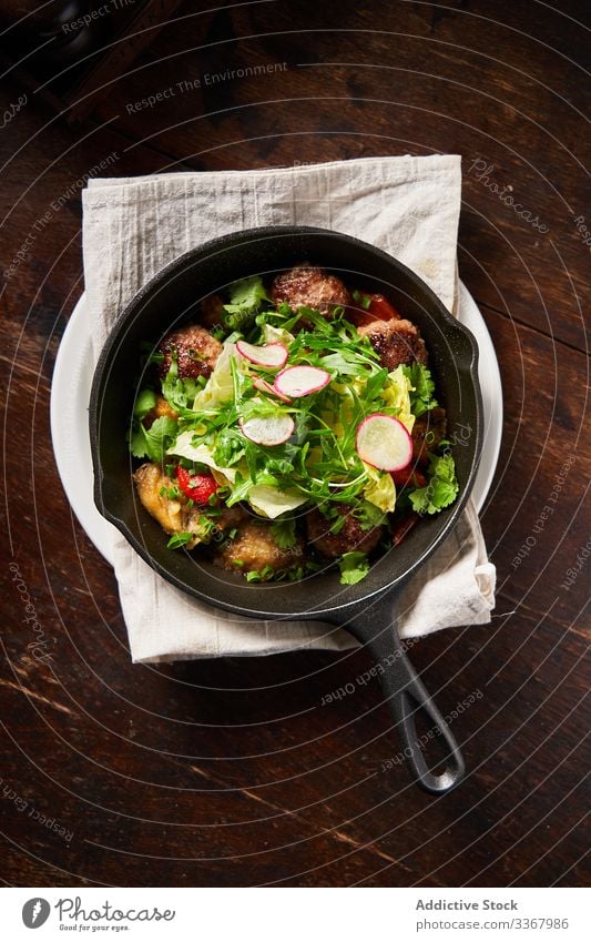 Roasted meatballs and salad in pan cutlets green herb tomato radish restaurant plate dinner food ingredient healthy organic delicious tasty decoration served