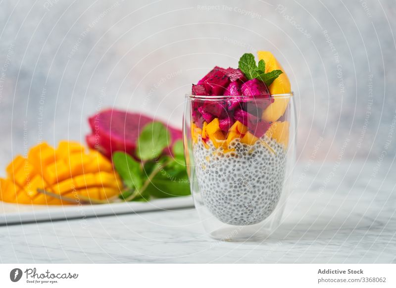 Delicious fruit dessert in glass pudding super food clean eating restaurant chia pitaya colorful red mango mint dish fresh delicious high cuisine exotic