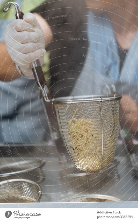 Anonymous person preparing pasta spaghetti cooked prepared fresh silver board cooking food meal cuisine traditional ingredient steel nutrition hot tasty