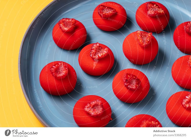 Bright red dessert on plate raspberry ball sweet food pastry colorful bright tasty cuisine dish delicious yummy scrumptious sugar calorie portion baked gourmet