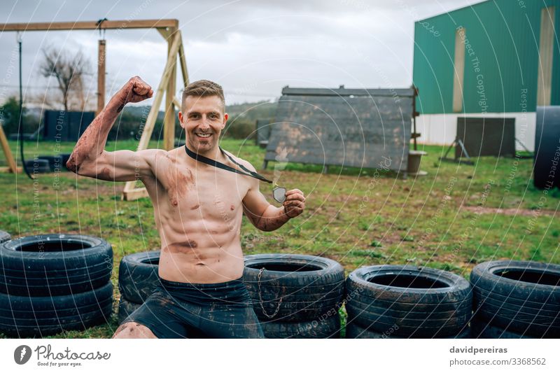 Athlete showing medal after race Happy Feasts & Celebrations Sports Award ceremony Success Human being Man Adults Smiling Authentic Strong Competition athlete