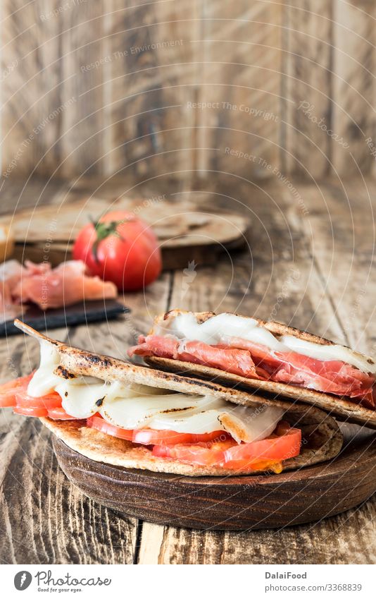 Piadina typical italian food Sausage Cheese Vegetable Bread Nutrition Lunch Vegetarian diet Plate Wood Fresh Above Black Tradition appetizer Rucola Bakery