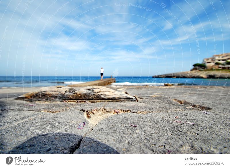 Blurred picture of a sharp woman Spain Majorca holidays Tourism Shallow depth of field Ocean Mediterranean sea Mole rock Horizon wide Coast bank Water Summer