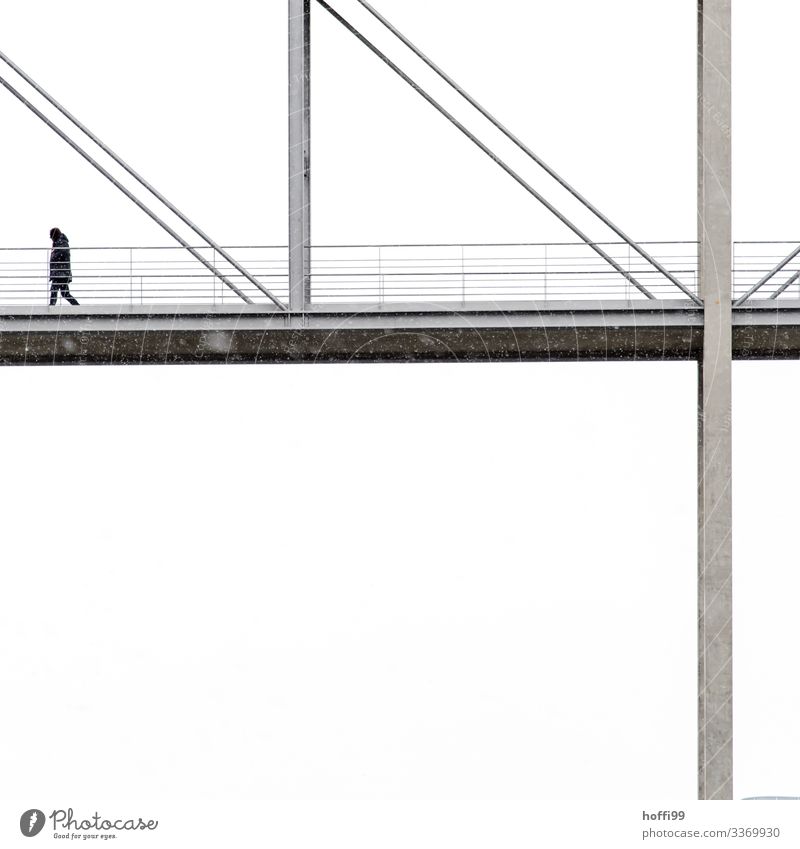 an anonymous person walks over a fragment of a bridge with white background in light snowfall Human being 1 Winter Bad weather Fog Snow Snowfall Capital city