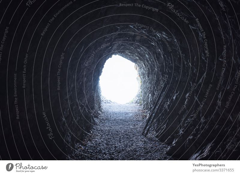 Tunnel in the Swiss Alps mountains. Sunlight at the tunnel end Adventure Freedom Expedition Earth Old Dark Creepy Natural Optimism Hope Horror Perspective