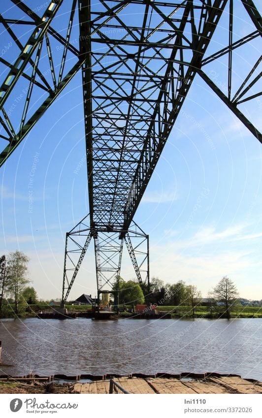 historical floating ferry across the Oste in Hemmoor Technology River bank Tourist Attraction Monument Inland navigation Ferry Steel Blue Gray Green Black Hover