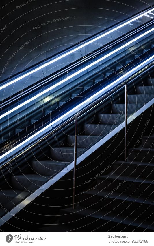 Escalator up with light bands Upward Banister Stone Glass Metal Cool (slang) conceit Sharp-edged Town Optimism Planning Light Light (Natural Phenomenon)