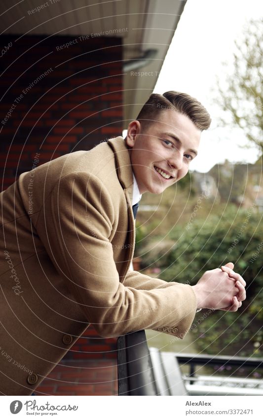 Portrait of a young man on the balcony Lifestyle Style Joy Beautiful Flat (apartment) Balcony Garden Young man Youth (Young adults) 18 - 30 years Adults