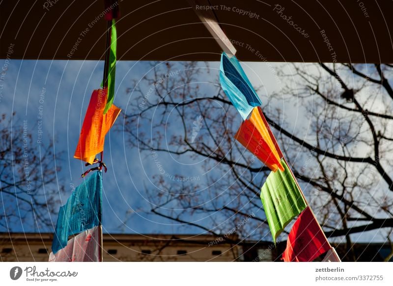 Prayer pennant berln Dalai Lama Flag flag prayer flag prayer pennant Back-light Deserted religion Schöneberg Sun Town Copy Space Tibet Blow Wind