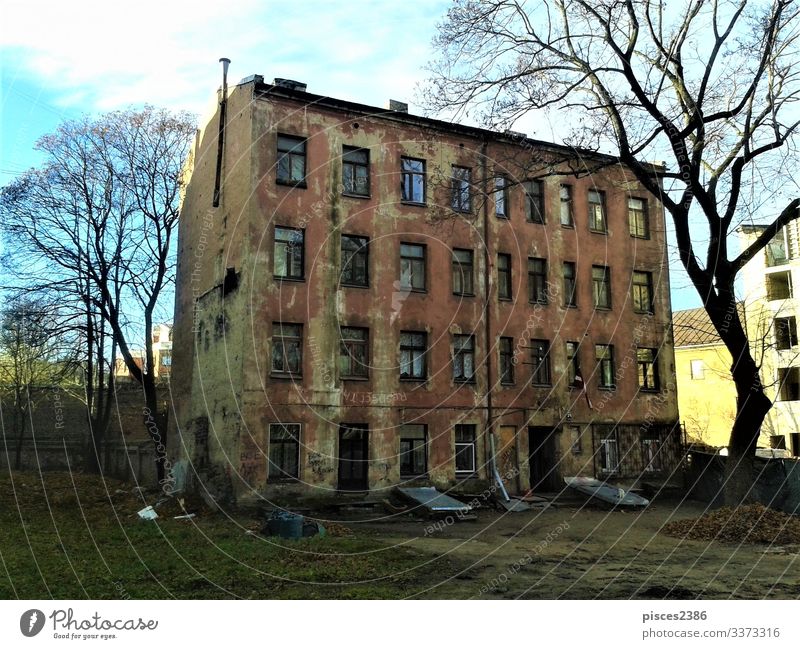 Shabby and weathered house in a Riga backyard Vacation & Travel Wall (barrier) Wall (building) Facade Poverty scene street old latvia medieval tourism town wood