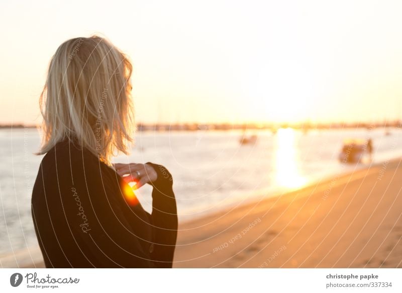 Young blonde woman looking at the sun on the beach Vacation & Travel Summer Summer vacation Sun Beach Ocean Feminine Young woman Youth (Young adults) Woman