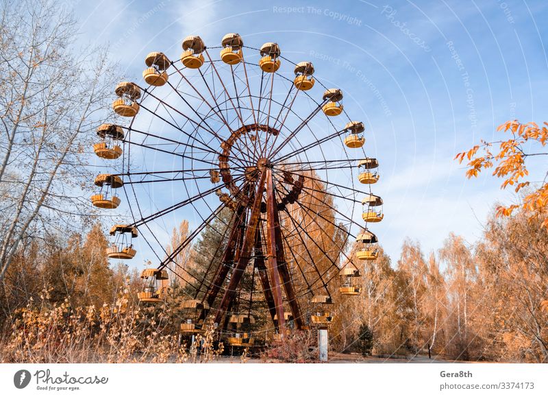 old carousel wheel in an abandoned amusement park in Chernobyl Vacation & Travel Tourism Trip Nature Landscape Sky Autumn Tree Leaf Park Rust Old Threat Blue