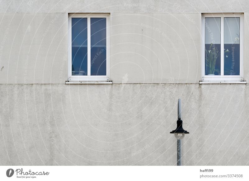 grey facade with two windows and street lighting Wall (building) Wall (barrier) Building Simple Elegant Modern Black Black & white photo Structures and shapes