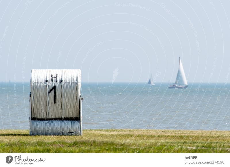 Beach chair on a green meadow with sailing boats in the background Sailing Vacation & Travel Summer vacation Ocean Cloudless sky Sun Spring Beautiful weather