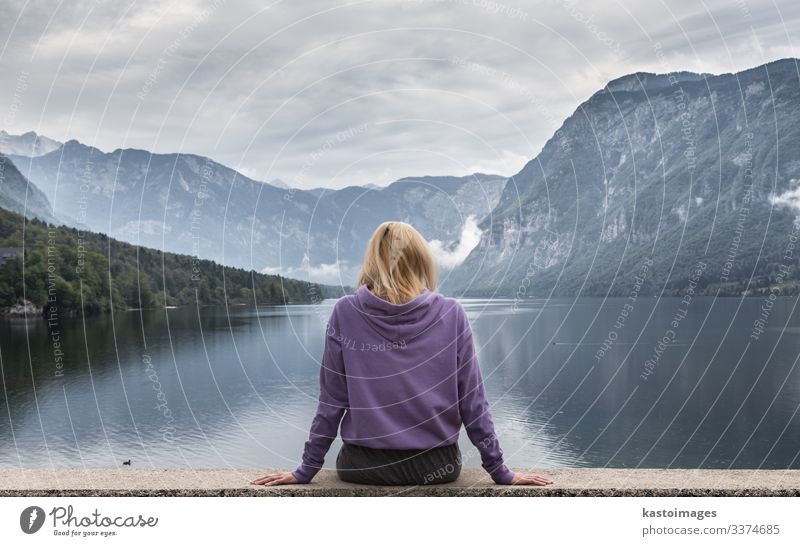 Sporty woman watching lake Bohinj, Alps mountains, Slovenia. Lifestyle Beautiful Relaxation Vacation & Travel Tourism Mountain Human being Woman Adults