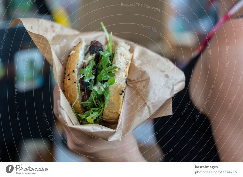 Woman holding juicy burger in her hands. Bread Roll Eating Lifestyle Style Joy Relaxation Vacation & Travel Summer Restaurant Craft (trade) Human being Adults