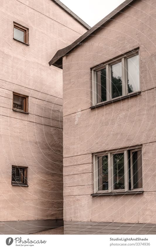 Two stone pastel colored buildings house houses window windows wall two Europe European Stockholm Sweden Swedish Scandinavia Scandinavian urban city town pink