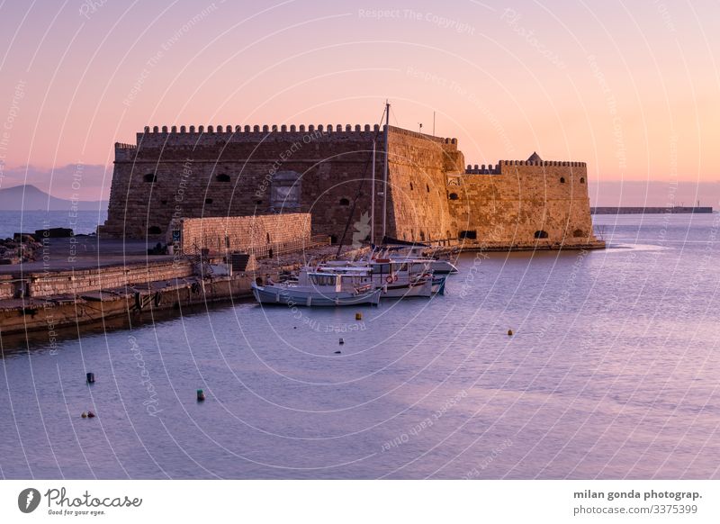 Heraklion Crete Greece Mediterranean Greek Europe landscape sea maritime harbour port tourism travel morning sunrise fortress castle Venetian boats