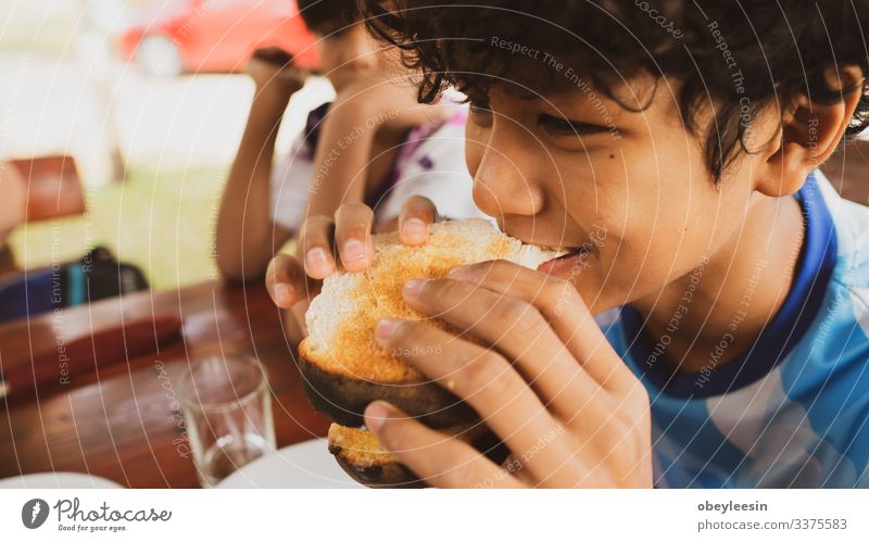 Young Happy Family Having Breakfast Fruit Bread Croissant Jam Eating Beverage Juice Coffee Plate Lifestyle Vacation & Travel Table Kitchen Stone Gray scenery