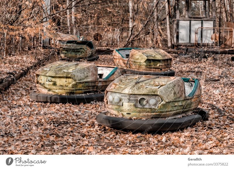 cars in an abandoned amusement park in Chernobyl Vacation & Travel Tourism Trip Nature Plant Autumn Tree Leaf Park Transport Car Rust Old Threat Retro Dangerous