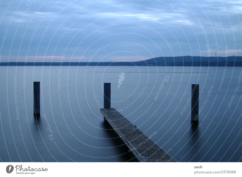 Long time exposure at the lake with footbridge and shore Long exposure Reflection Morning Dawn Contrast Copy Space bottom Copy Space top Exterior shot Deserted