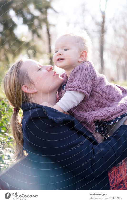 Mother with cheerful child in the park. Lifestyle Joy Happy Beautiful Leisure and hobbies Playing Child Toddler Woman Adults Man Parents Family & Relations