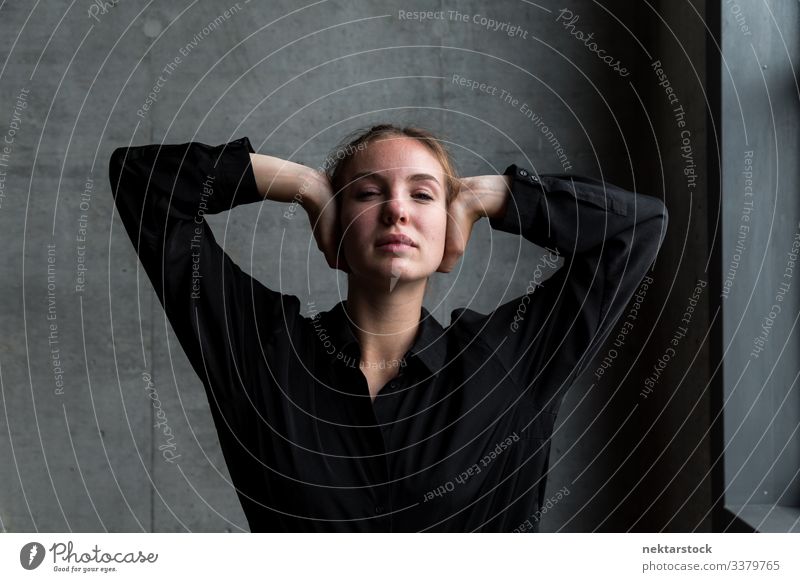 Young Caucasian Woman Covering Ears with Hands hands on head arms raised female girl woman young adult youth culture day beautiful woman natural beauty