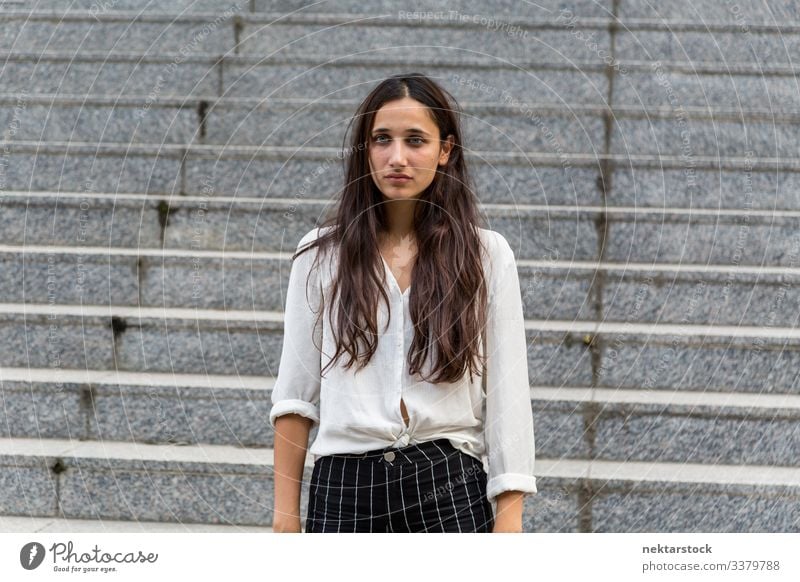 Young Middle Eastern Beauty Looking Away With Neutral Facial Expression female girl woman neutral facial expression standing young adult youth culture day urban