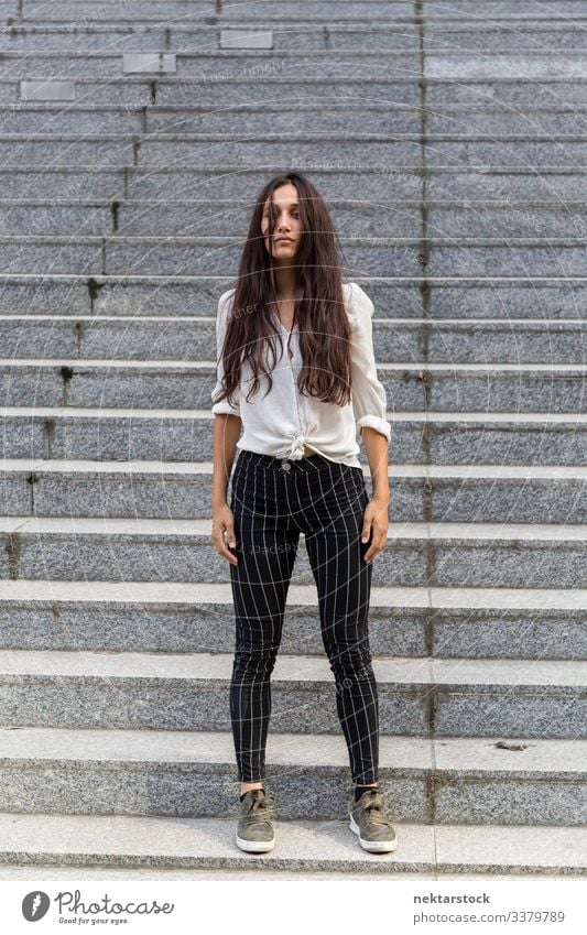 Natural Beauty Standing on Stone Steps female girl woman standing neutral facial expression young adult youth culture day urban beautiful woman natural beauty