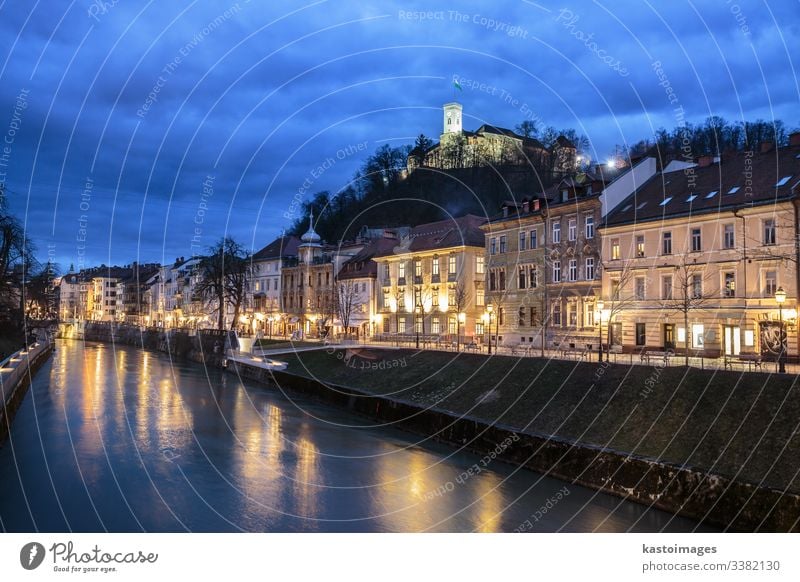 Evening panorama of riverfront of Ljubljana, Slovenia. ljubljana slovenia architecture blue bridge capital castle center city dark dusk europe european evening