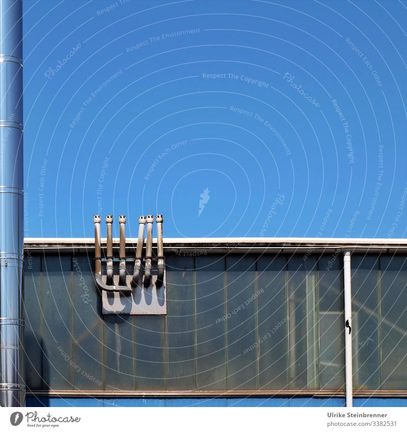 Industrial chimneys at warehouse in front of a blue sky Industry built Chimney Metal Sky Fireside Warehouse Hall Industrial plant High-grade steel Harbour