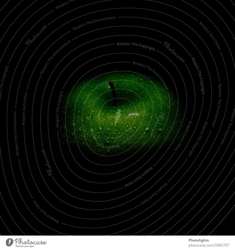 Green apple with water drops and black background Harvest green apple Nutrition Crunchy apple tree detail Stalk Fruit Dark Drops of water Delicious Fresh