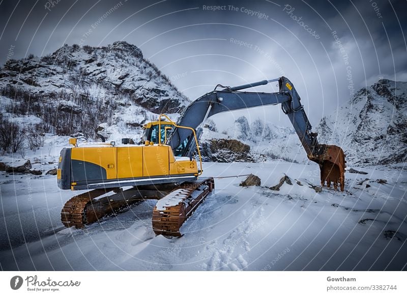 Old excavator in winter Norway norwegian Lofoten scenery Lofoten islands Lofoten archipelago scenic Nordland Scandinavia Scandinavian excavator cab grunge rusty