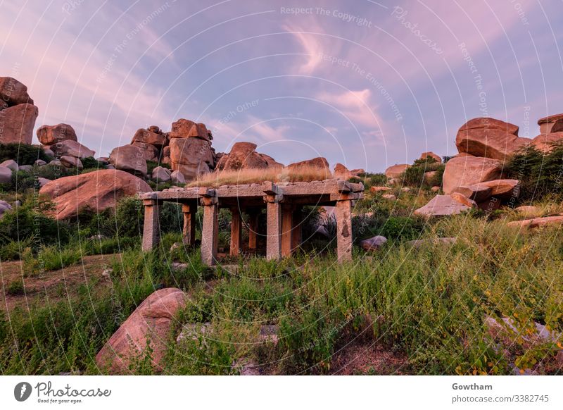 Ancient ruins of Hampi on sunset. India Hampi Bazaar Karnataka ancient architecture pillars pavilion HDR HDRI ancient civilization boulder boulders