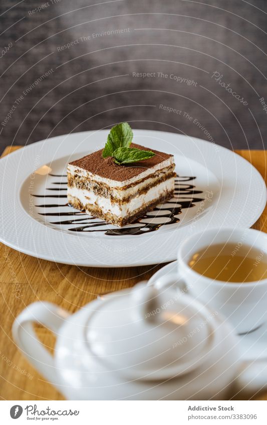 Sweet tiramisu and served tea on table cake dessert teapot drink restaurant delicious beverage fresh breakfast tasty sweet food gourmet mug hot natural flavor