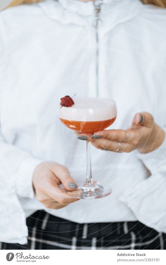 Unrecognizable waiter with Clover Club cocktail in restaurant alcohol drink beverage clover club raspberry red foam glass sweet relax gourmet delicious tasty