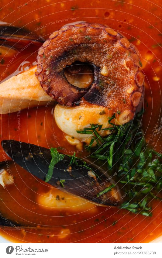 Delicious tom yum with octopus in restaurant soup seafood mussels asian food haute cuisine herb greenery delicious meal tasty dish lunch gourmet portion