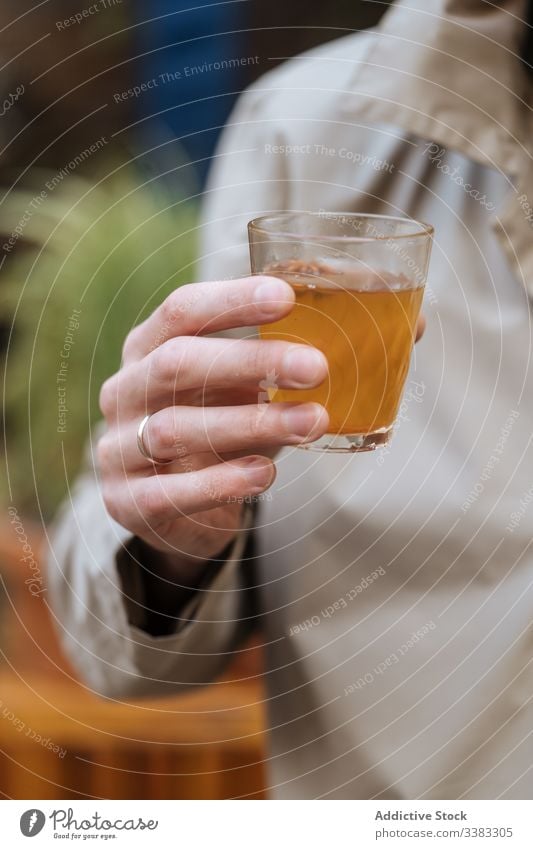 Unrecognizable man drinking alcohol beverage at party glass cup cafe restaurant relax male holiday cocktail liquid refreshment celebrate delicious enjoy festive